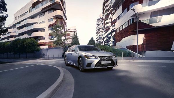 A Lexus LS driving around a corner