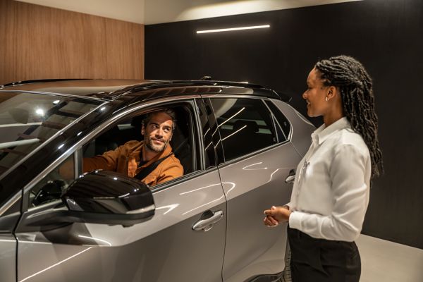 customer in Toyota vehicle at dealership